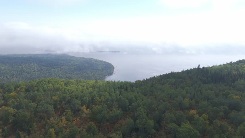 aerial view of the lush forest at Sleeping Giant, Ontario, showcasing a vast expanse of green stretching toward the cliffs and Lake Superior.