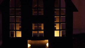 A haunting castle stands under the moonlight, illuminated by flickering candles. Shadows dance in windows, casting an eerie ambiance that embodies Halloween fear and horror - Powered by Shutterstock - Get 15% off with code: PIKWIZARD15