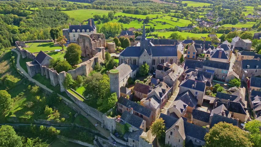 Sainte-Suzanne Castle aka Chateau de Sainte-Suzanne and old ruin belvedere surrounded by medieval town of Sainte-Suzanne from above, Mayenne, France.
