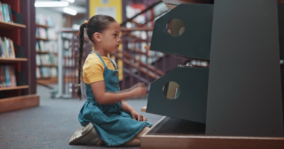 Search, girl and child in library, books and knowledge with education, development and learning. Student, kid and growth with storytelling, fantasy and hobby with shelf, literacy and language