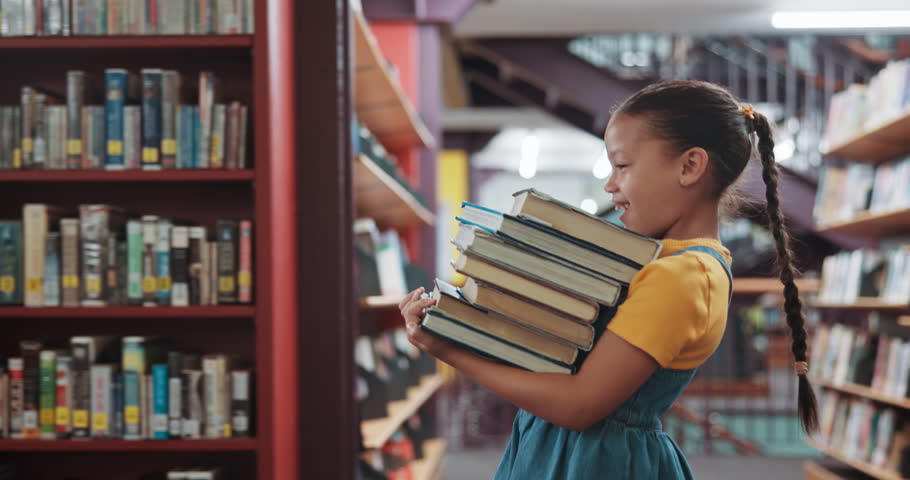 Happy, library and child carry books for learning, education and language development. Walking, literacy and girl with literature, storybook stack and excited for knowledge, research and information