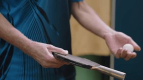 Close up partial view of athlete holding racket handle during tennis play, focus on grip and paddle technique, showing details of hand control, training practice, and intensity of indoor game - Powered by Shutterstock - Get 15% off with code: PIKWIZARD15