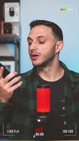A man recording a podcast interview in a modern studio setup with microphone, headphones, and camera overlay showing REC symbol. Concept of digital broadcasting, influencer talk, and content creation