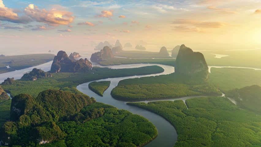 Scenic of Phang Nga bay with mountains at sunset in Thailand.