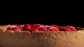 Raspberry Tart Side View. A raspberry tart rotates gracefully, revealing the baked crust and vibrant fruit topping. A perfect mix of rustic texture and fresh color. - Powered by Shutterstock - Get 15% off with code: PIKWIZARD15