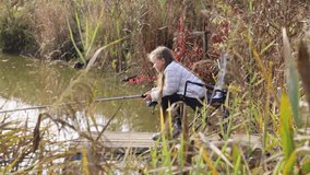 A little girl fishing with a fishing rod on an autumn pond - Powered by Shutterstock - Get 15% off with code: PIKWIZARD15