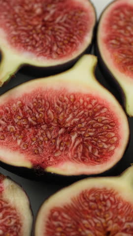 Fresh Sliced fig fruit macro, rotate. Healthy vegan snack idea