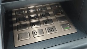 Hand pressing button on ATM keypad for banking transaction. Close-up of a person pressing the keypad on an ATM machine, representing finance, banking, technology, and digital transaction activity. - Powered by Shutterstock - Get 15% off with code: PIKWIZARD15