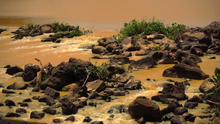 The river after the rains.  The Kai Mountain River in Nha Trang with a muddy bottom turns dirty after rains in the mountains. 