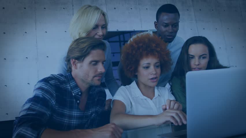 Rotating 3D globe logo animation fading and revealing coworkers reviewing business slides on laptop. Corporate, teamwork, innovation, professional, collaboration, modern, technology