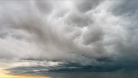 Tranquil scene of cumulus clouds drifting beneath golden sunset skies, showcasing the peaceful beauty of nature with warm light and gentle atmospheric motion - Powered by Shutterstock - Get 15% off with code: PIKWIZARD15