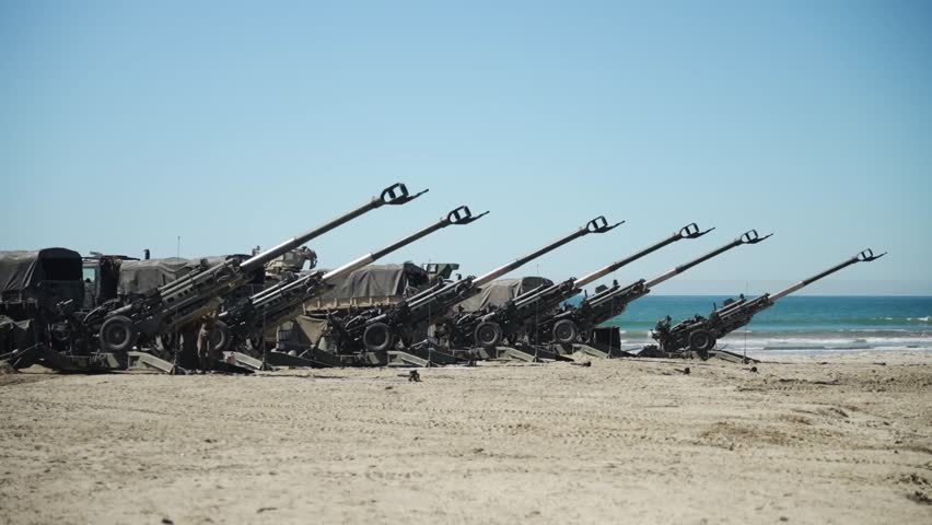 U.S. Marines fire an M777 155 mm light howitzer.