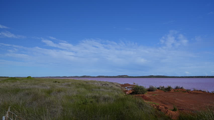 view over the stunning colorful lake at Hutt lagoon, Port Gregory, Western Australia, pink water caused by bacteria and algae.