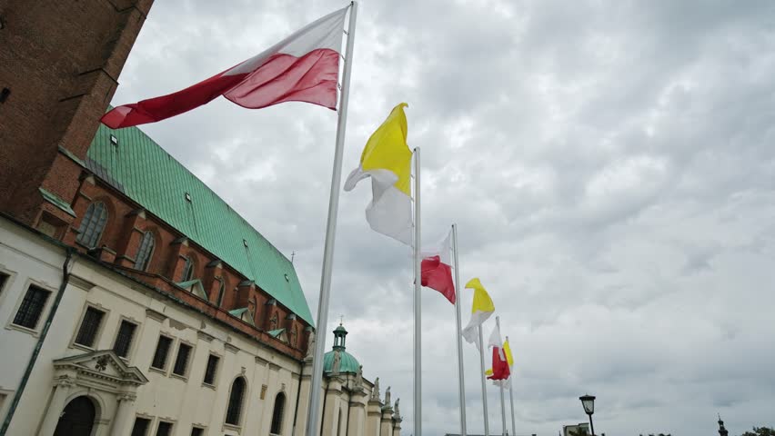 Waving Poland And Vatican Flags Near Gniezno Cathedral