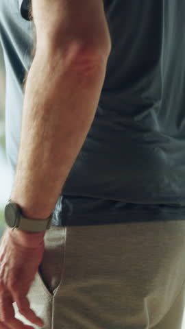 Back pain, crisis and hands of old man in home for fibromyalgia, injury emergency or pressure. Muscle inflammation, osteoarthritis and sprain with senior person in living room of apartment for cramps