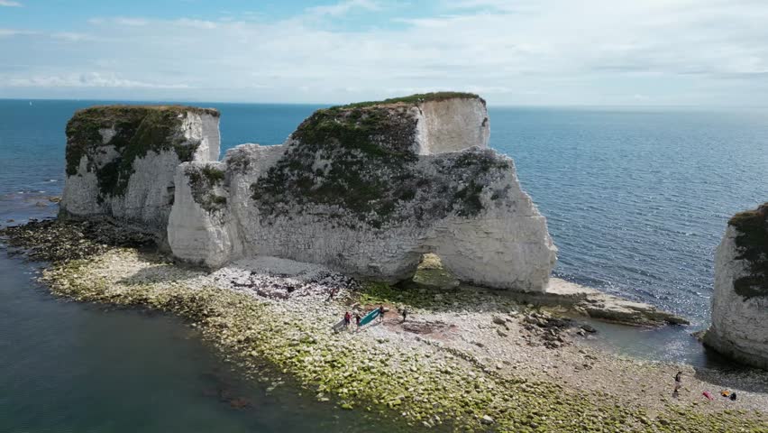 Drone video capture of the Dorset coast in the UK near Swanage and Old Harry Rocks on a warm summer day