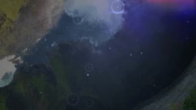 Opening canyon shot, waterfall cascading into water as HUD circles appearing, beams forming overlay. Landscape, drone, futuristic, technology, nature, moody, exploration - Powered by Shutterstock - Get 15% off with code: PIKWIZARD15