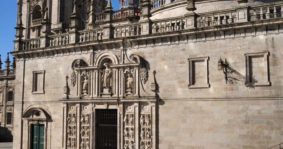 The clock tower and facade from the Quintana square. The Cathedral, Santiago de Compostela, Spain.