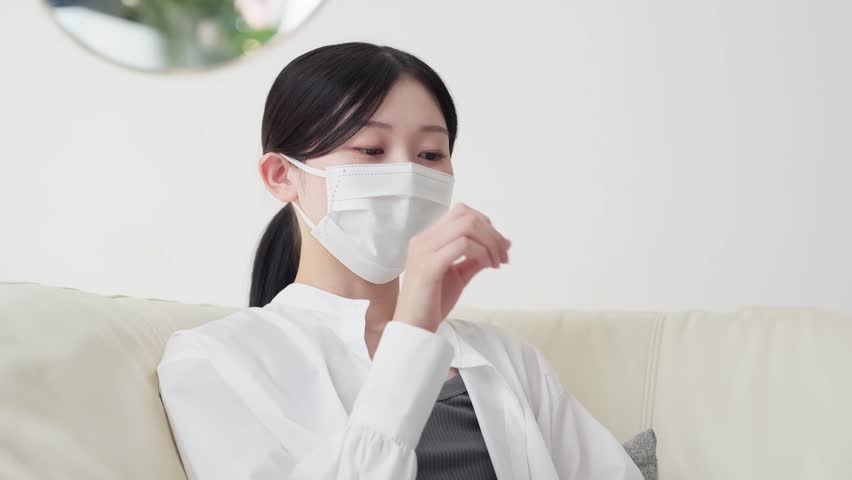 Asian woman with a cold and cough
