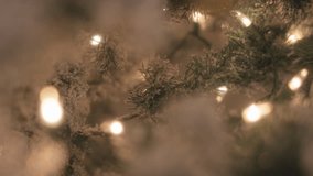 Christmas tree decorated with warm light garland. Slow motion. - Powered by Shutterstock - Get 15% off with code: PIKWIZARD15