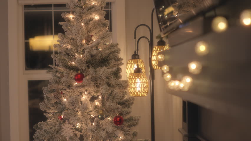 Decorated Christmas tree in the living room. Slow motion.
