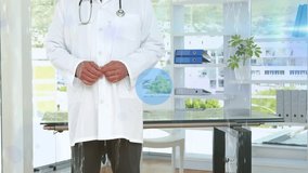 Male doctor standing center room, blue icons appearing around him illustrating health data flow. Medical, professional, healthcare, digital, technology, communication, innovation - Powered by Shutterstock - Get 15% off with code: PIKWIZARD15