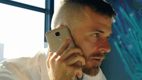 Businessman lifting phone to ear making call in office with floating alerts showing engagement. Digital, communication, technology, networking, connectivity, professional, modern - Powered by Shutterstock - Get 15% off with code: PIKWIZARD15