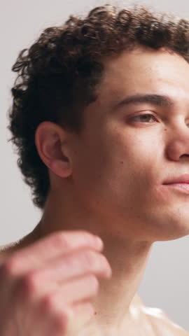 Man, fitness or music with earphones in studio for audio streaming or podcast on a white background. Active, male person or model listening with ear pieces or vibe for sound app, melody or rhythm