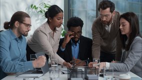 Diverse business team Caucasian African American Indian businesspeople women men talking discussing in office working with documents paperwork partnership multinational coworkers briefing cooperate - Powered by Shutterstock - Get 15% off with code: PIKWIZARD15