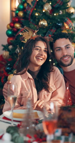 Smile, couple and picture at Christmas party for photography, reunion and bonding together. Happy, people and embrace for photo at lunch, social gathering and festive memory for new years at house