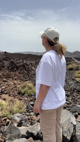 Exploring a stunning volcanic landscape beneath a vast, cloudy sky is an invigorating experience