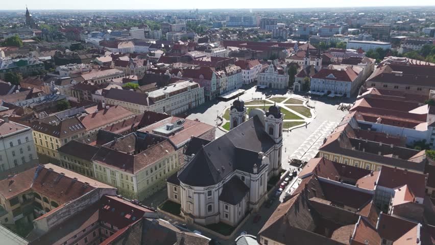 Timisoara aerial shot approaching Saint George’s Catholic Cathedral, capturing the structure and landmark features from above.