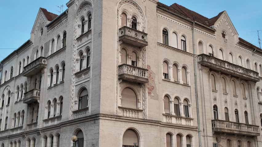 Exterior footage of a historic building in Szeged, Hungary, highlighting architectural details and heritage features.