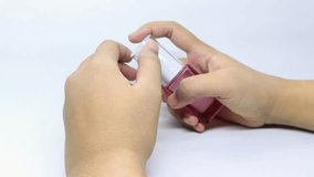 Person applying clear gel like skincare product from a small pink pump bottle onto the back of their hand, then spreading it gently - Powered by Shutterstock - Get 15% off with code: PIKWIZARD15