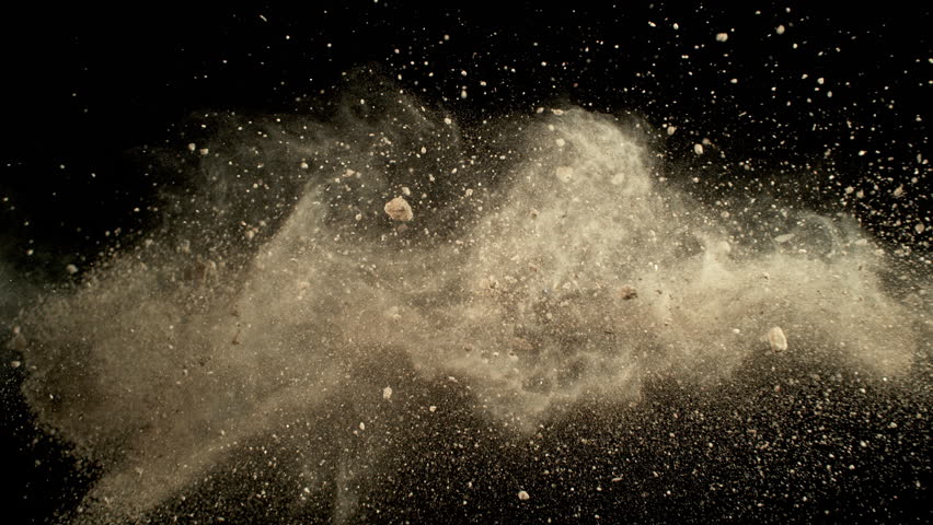 Super Slow Motion of Soil, Rocks and Dust Colliding with Each Other Isolated on Black at 1000fps.