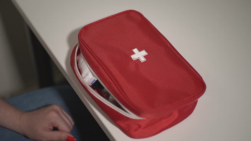 First aid kit on the table. First aid kit. Slow motion.High quality 4k footage