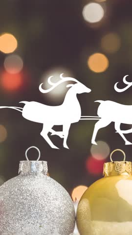 Santa in sleigh with reindeer animation over Christmas ornaments and lights. holiday, festive, celebration, decorations, Santa Claus, winter