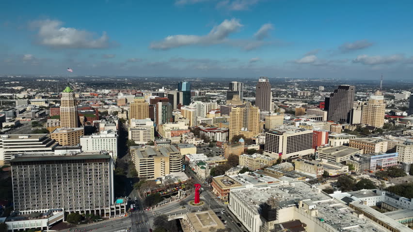 Panoramic drone shot of the San Antonio skyline, sunny evening in Texas, USA