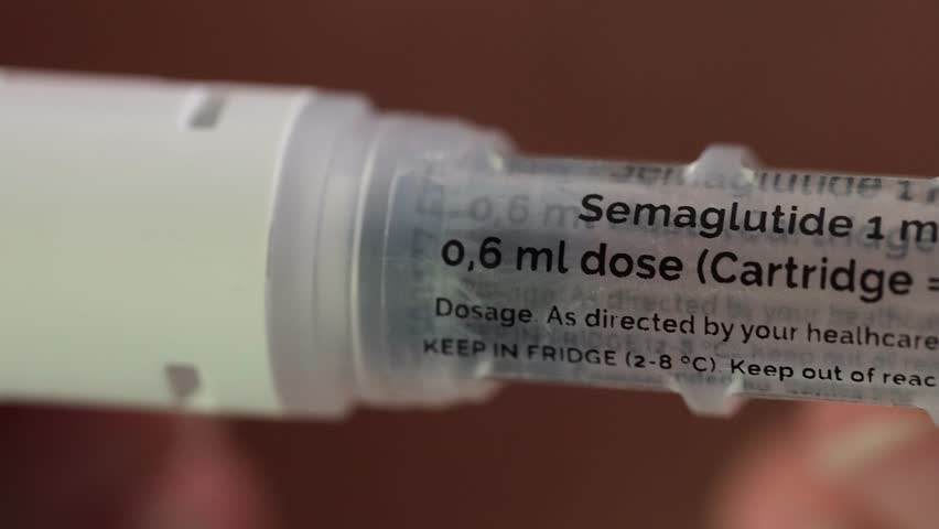 Close up view of injection pen containing semaglutide medication