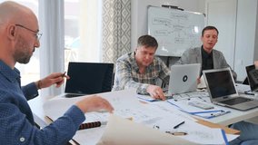 business meeting underway, executives analyze budgets and future predictions in professional setting, three team members collaboratively review company budgets and discuss forecasts in calm - Powered by Shutterstock - Get 15% off with code: PIKWIZARD15