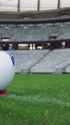 Animation of icons and data processing over rugby ball on field. Global sports, competition, connections, computing and data processing concept digitally generated video.