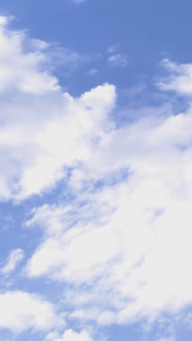 A tranquil time-lapse from an airplane window shows soft white clouds drifting over a deep blue sky, evoking calm aerial serenity—ideal for travel, relaxation, or background visuals.