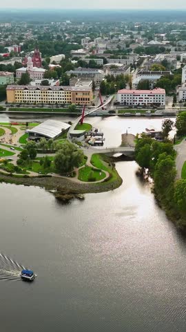 Drone glides toward Mītava Bridge crossing the Driksa River to Pasta Island in Jelgava, Latvia