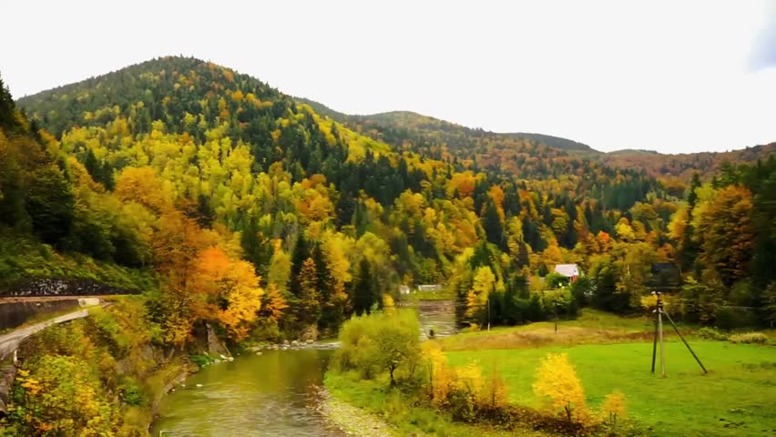 silhouettes of peaks, beautiful autumn mountain landscape, golden autumn, yellow trees and fog, layers of slopes