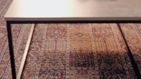 Young diverse couple happily talking and drinking coffee together on the sofa in their living room - Powered by Shutterstock - Get 15% off with code: PIKWIZARD15