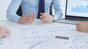 Business people having a financial meeting, discussing company strategy, reviewing data analysis, and planning future growth using charts and reports - Powered by Shutterstock - Get 15% off with code: PIKWIZARD15