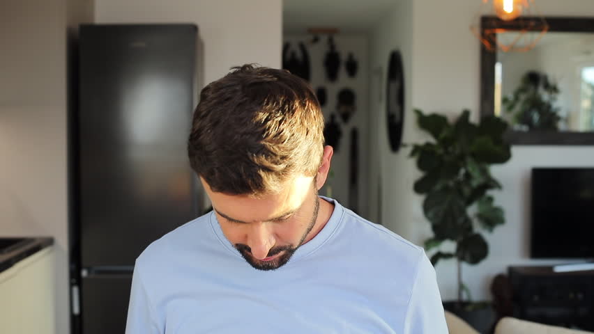 Cheerful man holding a "HAPPY" sign 