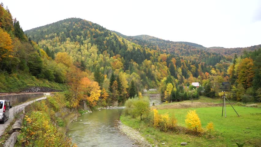  silhouettes of peaks, beautiful autumn mountain landscape, golden autumn, yellow trees and fog, layers of slopes