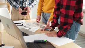 Teamwork brainstorm. Unrecognizable diverse colleagues working together discuss financial statistics. Group of people in creative office discussing business, focus on hands close up. Professional team - Powered by Shutterstock - Get 15% off with code: PIKWIZARD15
