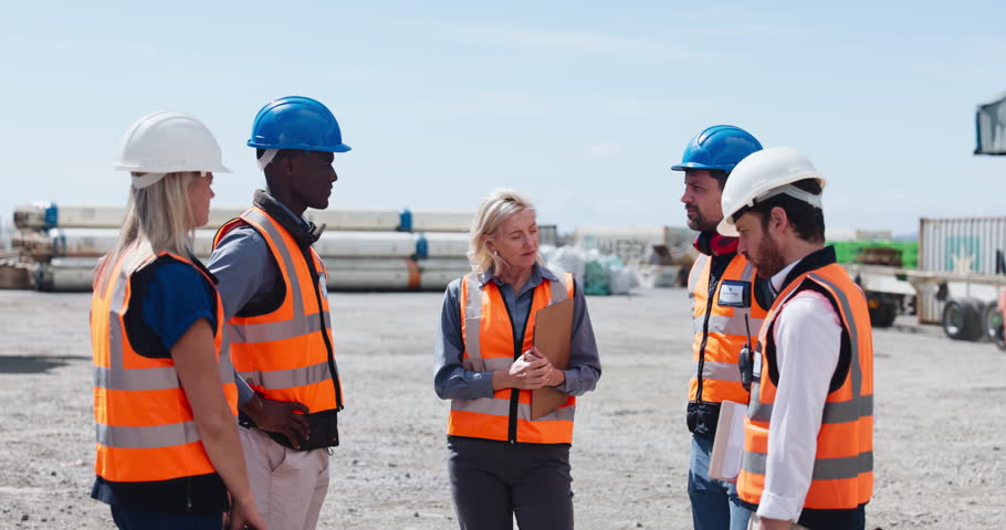 Happy, supervisor and handshake with team, construction site and agreement for property development. Architecture, men and shaking hands with colleagues, civil engineers and collaboration with women